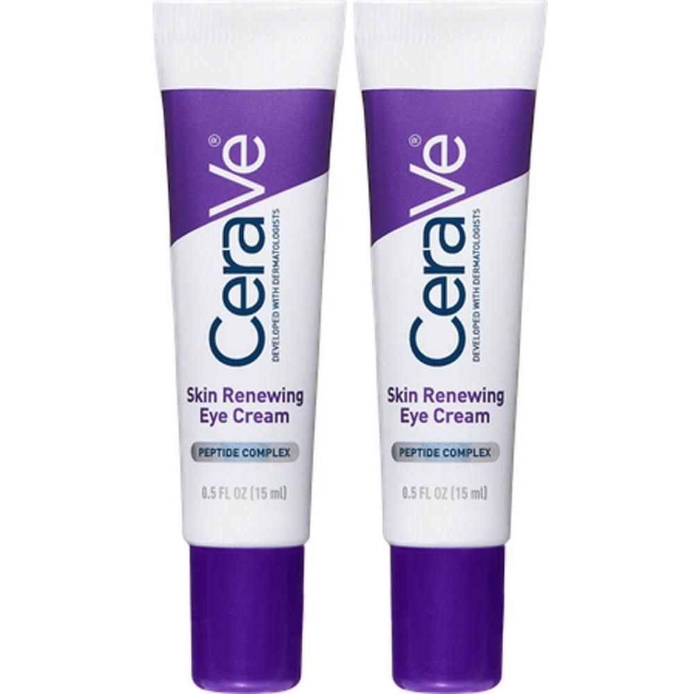 Deux tubes de crème pour les yeux CeraVe Skin Renewing. Emballage blanc et violet. Texte : Skin Renewing Eye Cream, Peptide Complex, 0.5 FL OZ (15 ml).