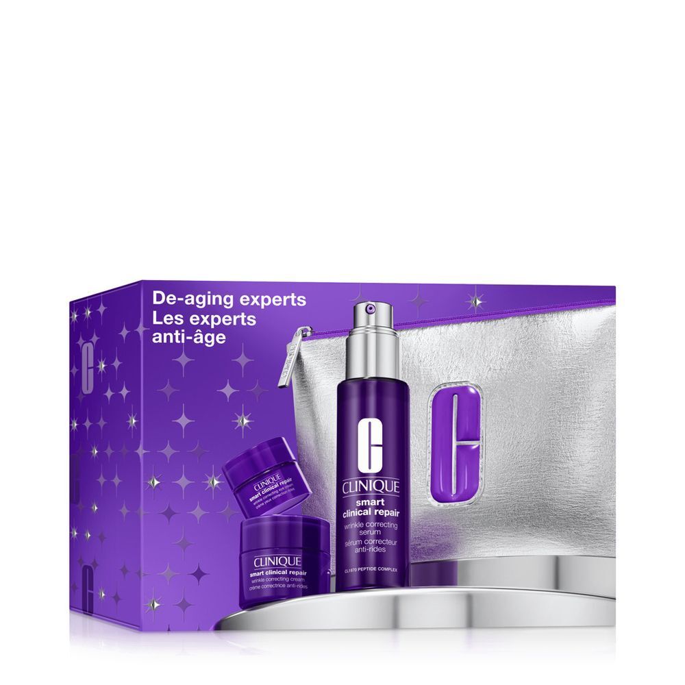 Clinique Smart Clinical Repair Set mit Serum und Cremes in lila Verpackung und silberner Kosmetiktasche.