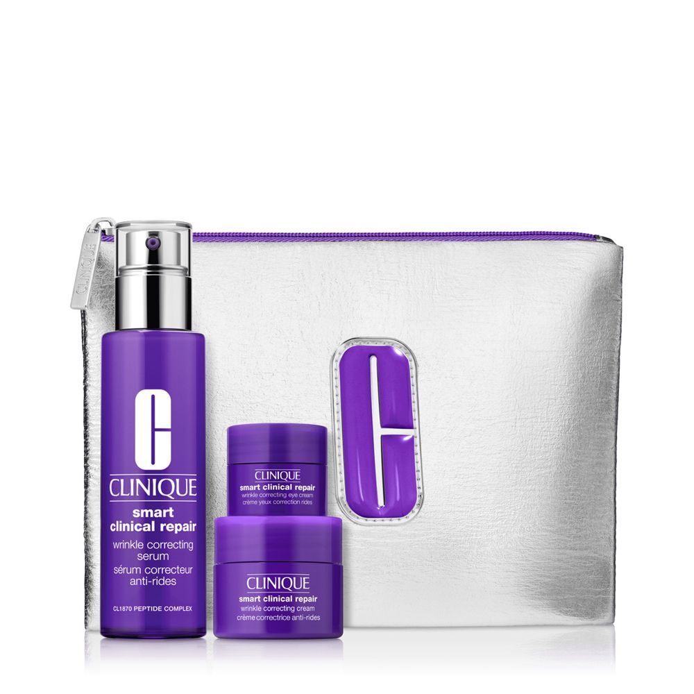 Clinique Smart Clinical Repair Set mit Serum und Cremes in lila Verpackung und silberner Kosmetiktasche.