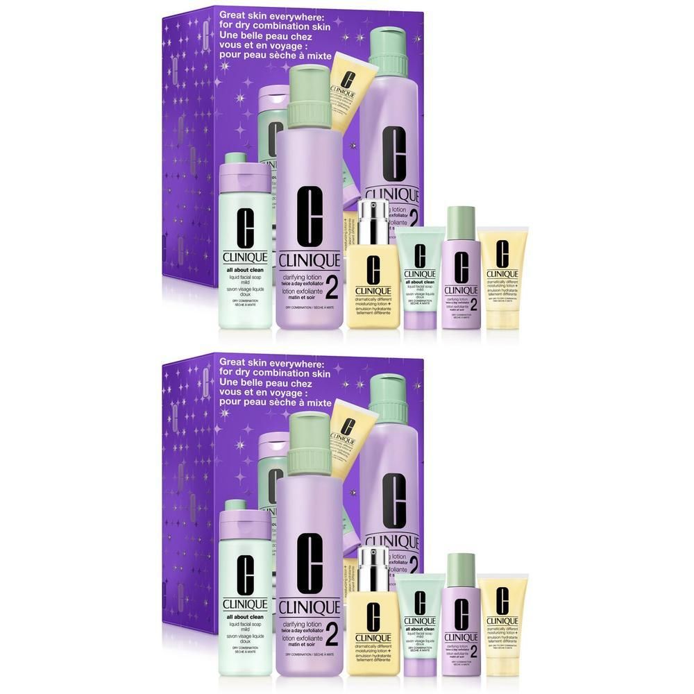 Clinique Hautpflege-Set mit mehreren Flaschen und Tuben in lila und grüner Verpackung.