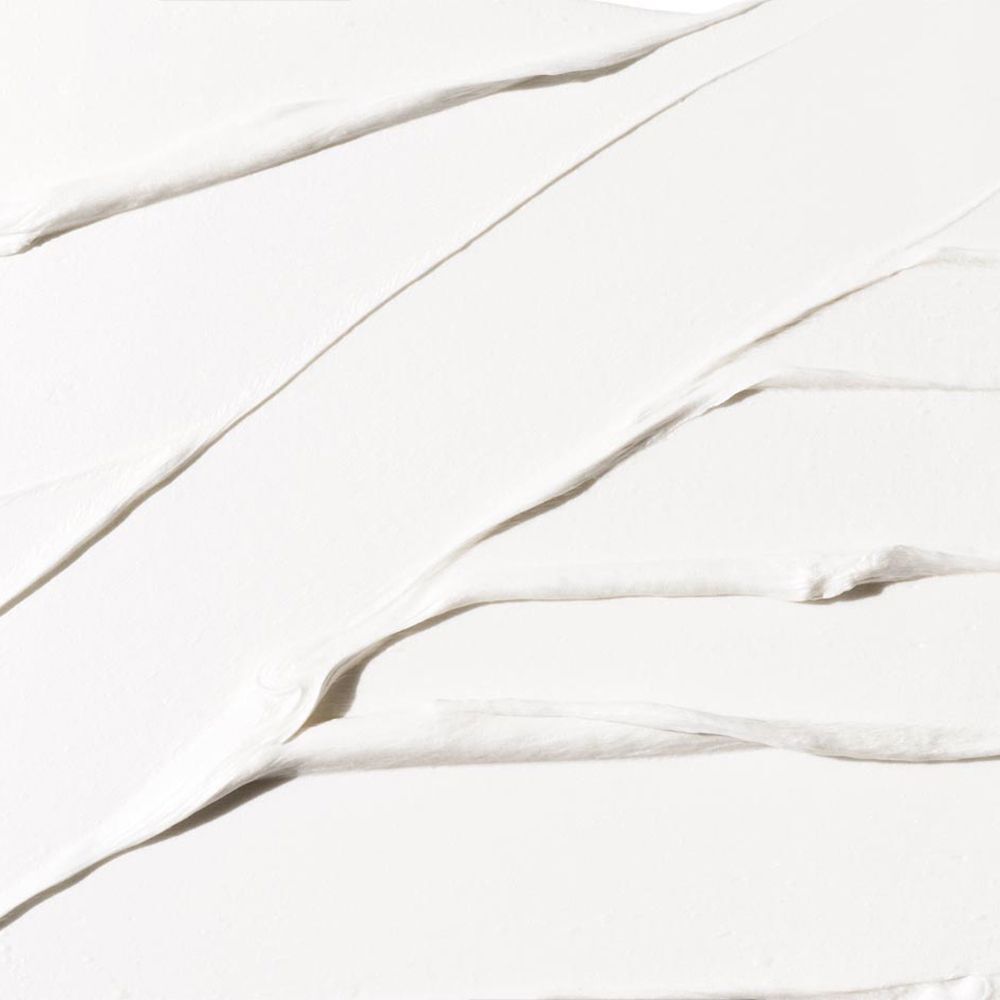 Nahaufnahme der weißen Textur von Clinique For Men Cream Shave Rasiercreme.
