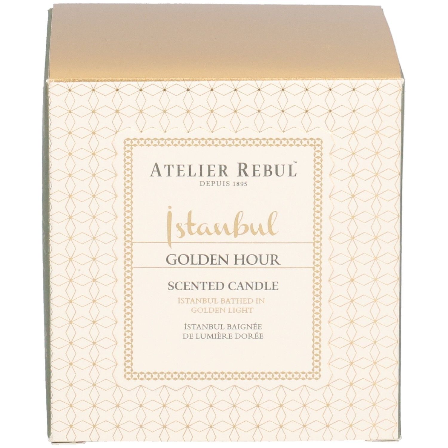 Quadratische Verpackung. Aufschrift: Atelier Rebul, Istanbul Golden Hour Scented Candle. Goldfarbener Deckel, cremefarbene Seiten mit Muster.