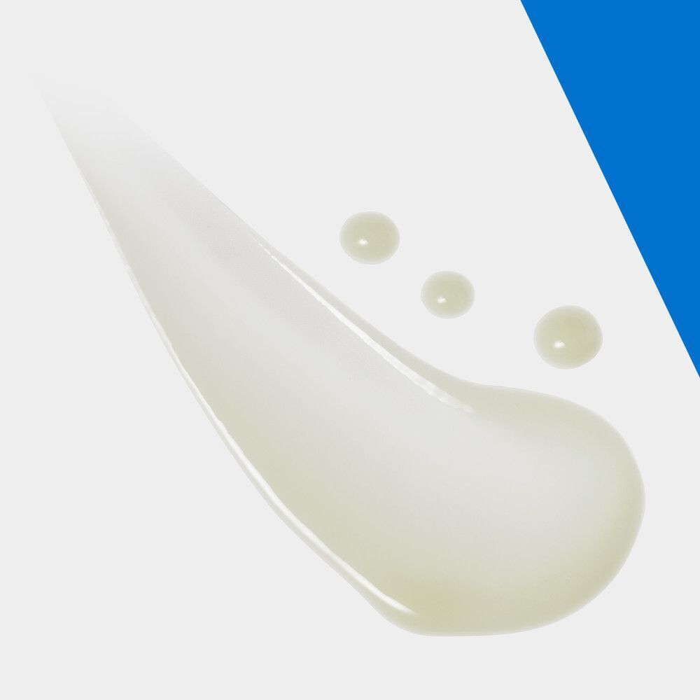Gouttes de sérum sur fond blanc. Trois gouttes.