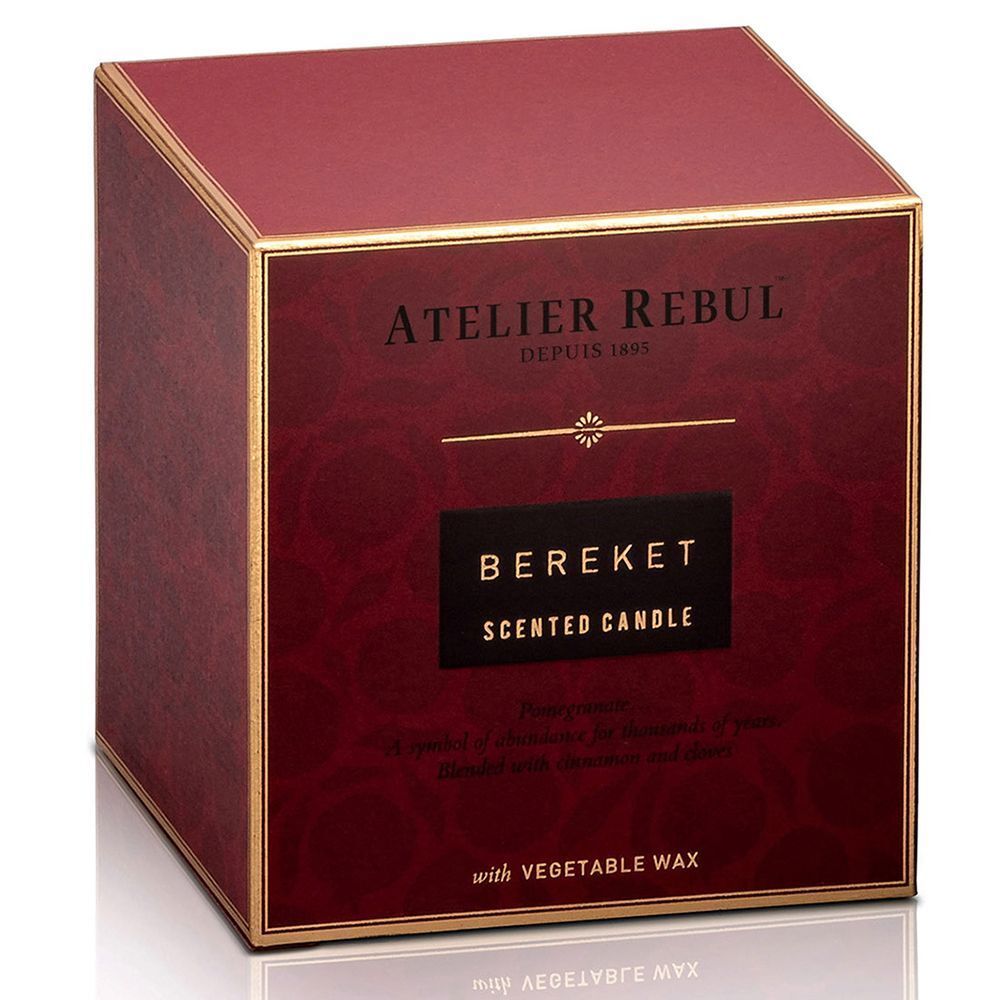 Eine rote Geschenkbox mit goldener Umrandung für die "Bereket" Duftkerze von Atelier Rebul.