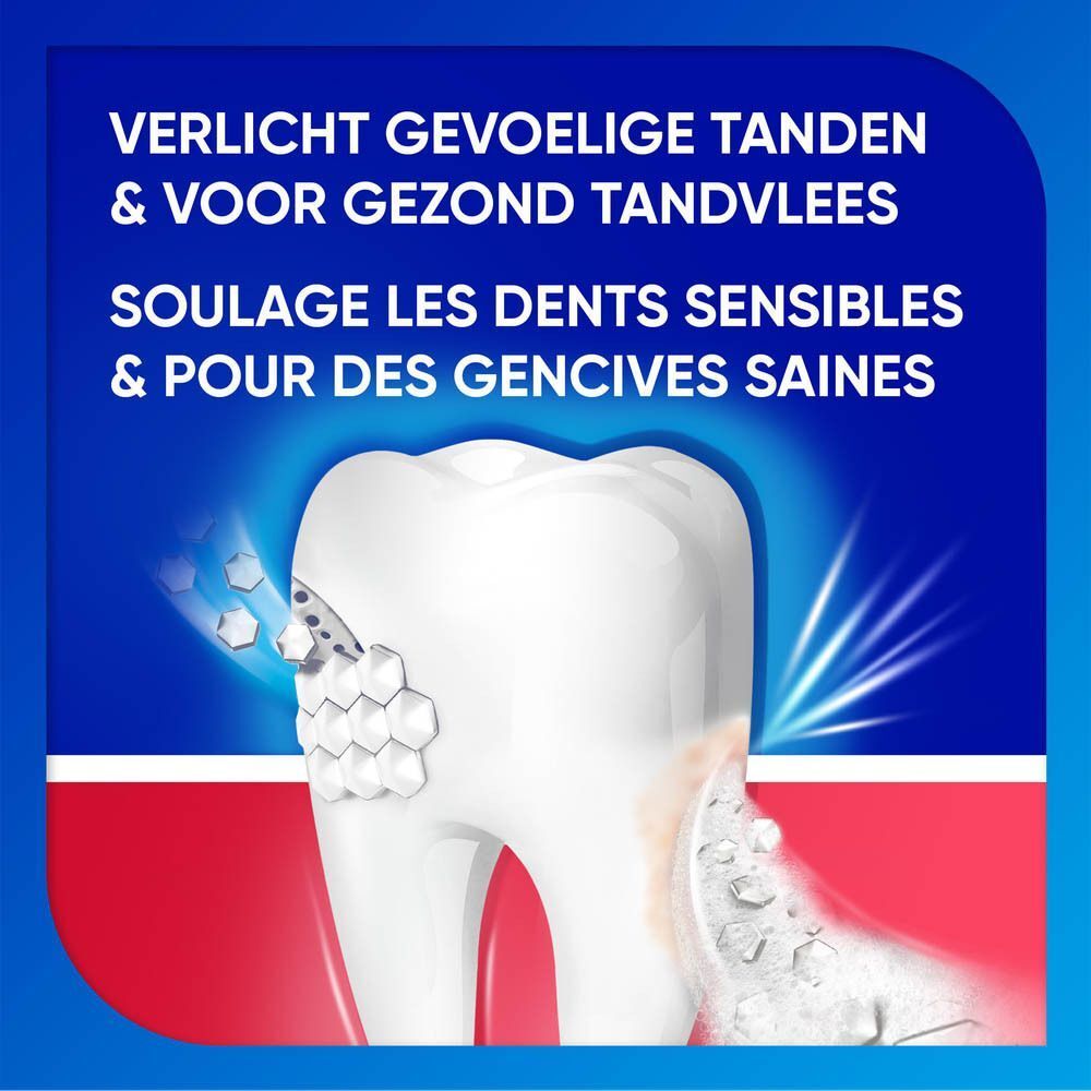 Dent avec caries et inflammation des gencives, entourée de bulles.