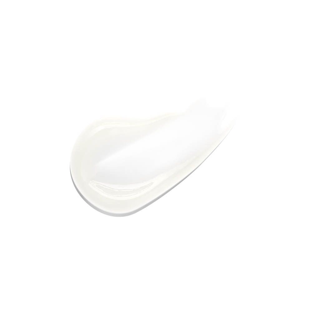 Une traînée de crème blanche sur fond blanc.