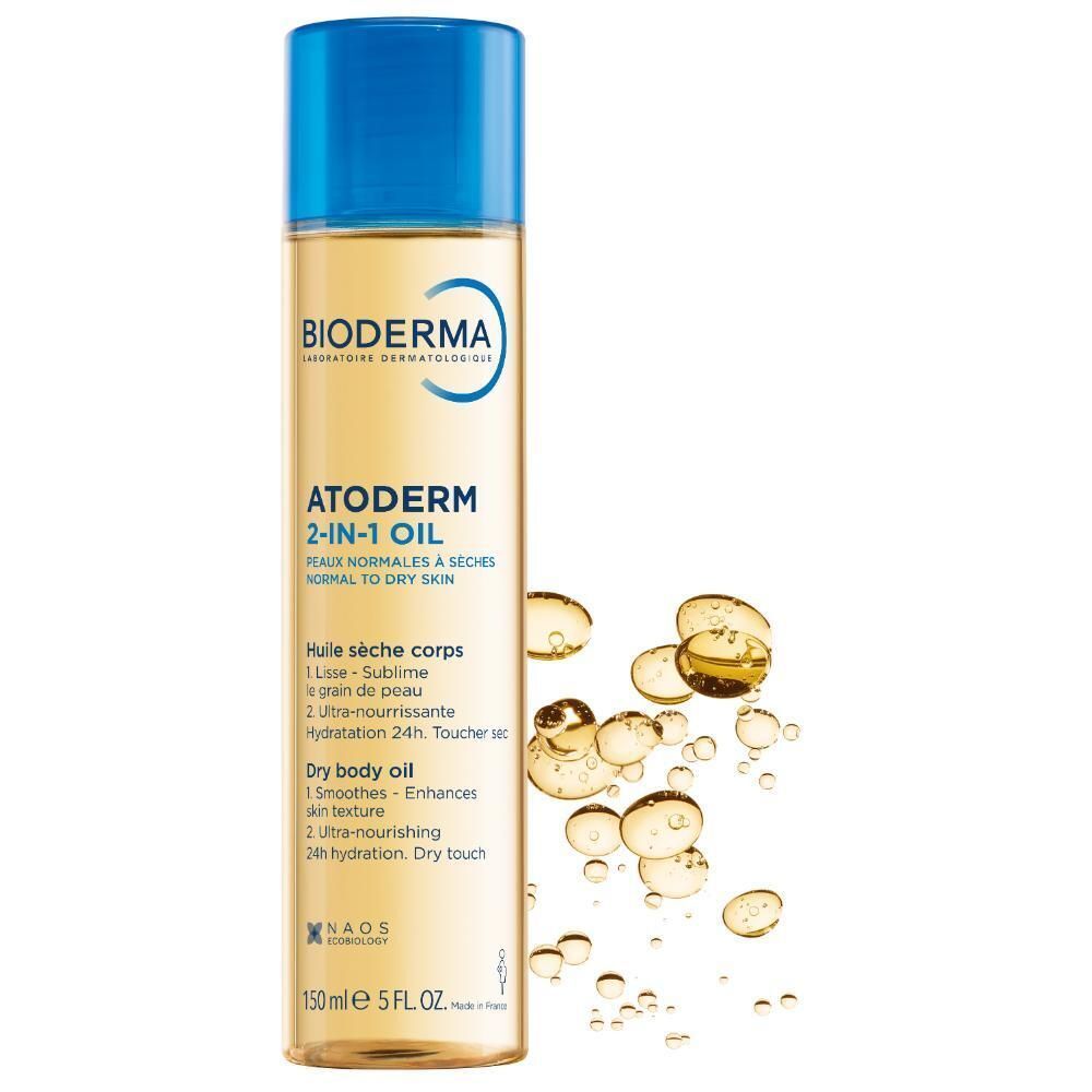 Een fles Bioderma Atoderm 2-in-1 Olie met oliedruppels ernaast.