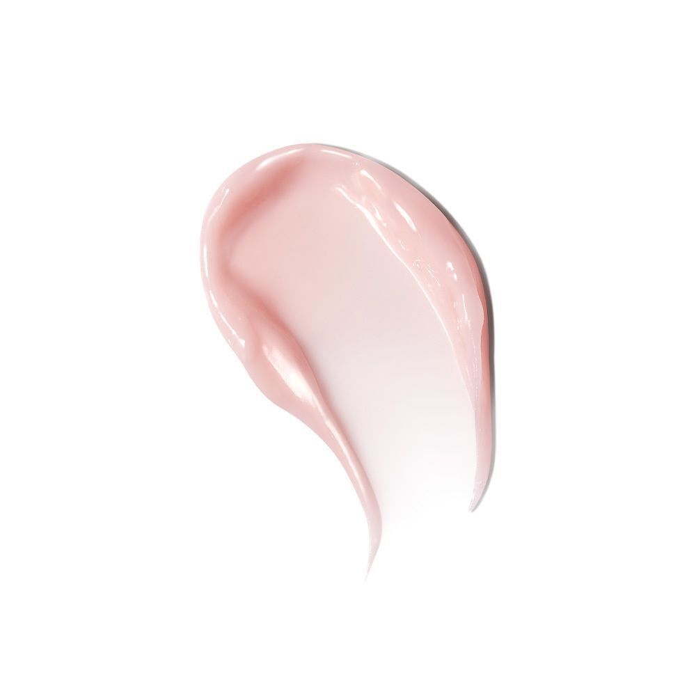 Ein Tupfer rosa Creme auf weißem Hintergrund.