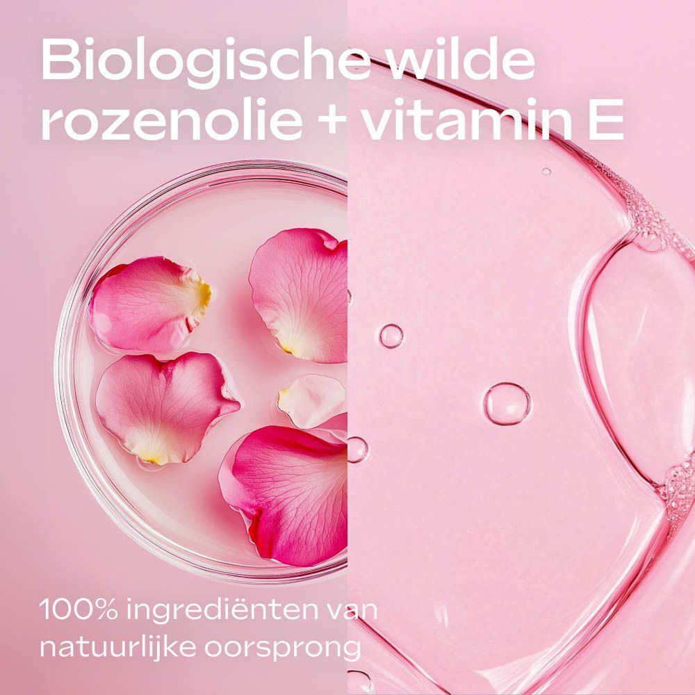 Rozenblaadjes en vitamine E in een petrischaal en vloeistof. 100% natuurlijke ingrediënten.