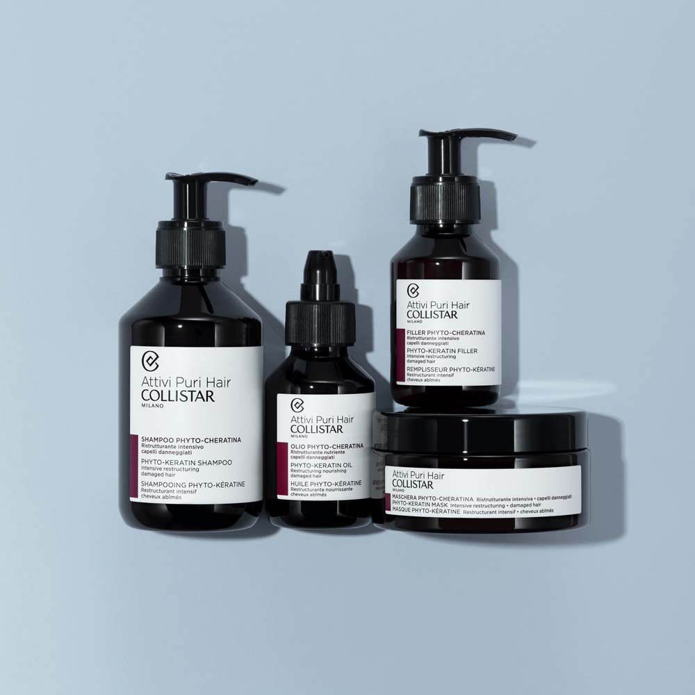 Collistar Attivi Puri Hair verzorgingsset met shampoo, olie en masker in donkere flessen en potjes.