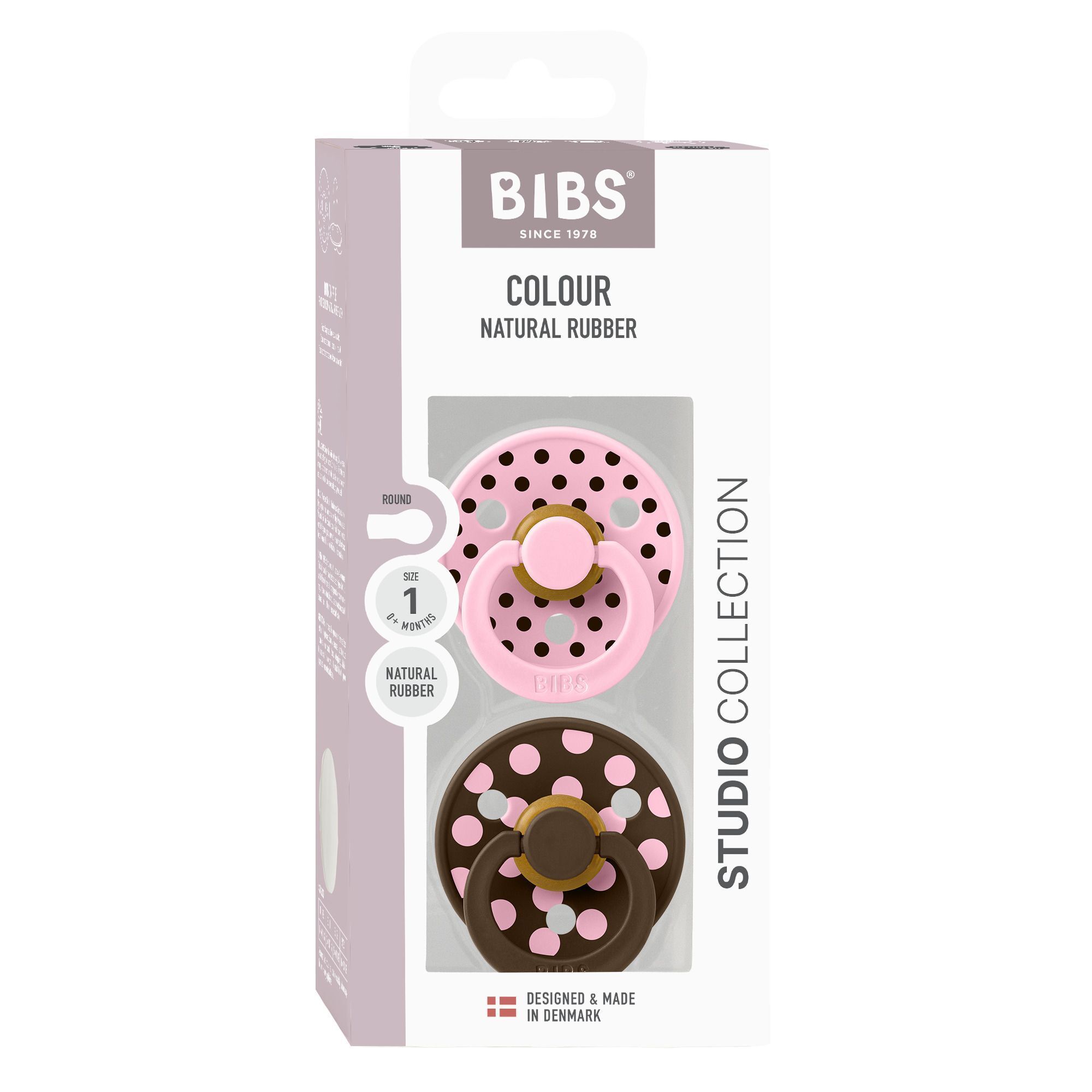 Twee BIBS spenen: één roze en één bruine met roze stippen.
