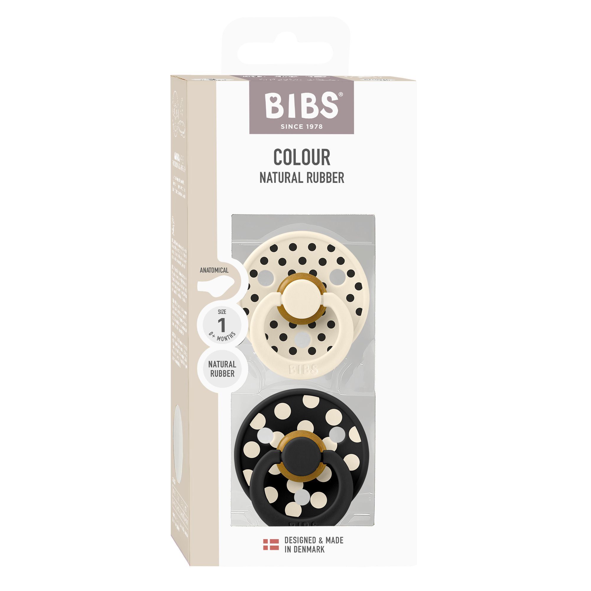 Deux sucettes BIBS dans un emballage. Une est crème, l'autre noire à pois blancs.