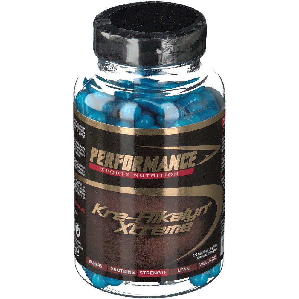 Flacon transparent rempli de gélules bleues. Inscription : Performance Kre-Alkalyn Xtreme. Bouchon noir.
