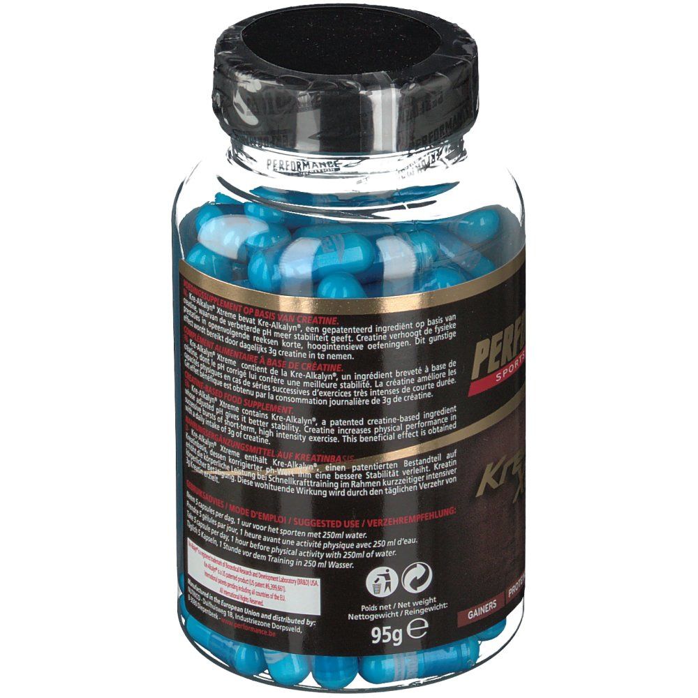 Flacon avec gélules bleues. Étiquette avec texte. Bouchon noir. Inscription : Performance Kre-Alkalyn Xtreme, 95g.