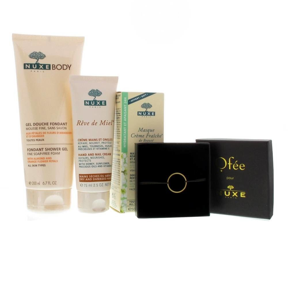Plusieurs produits cosmétiques, dont un tube de Nuxe Body Gel Douche Fondant et un tube Rêve de Miel Crème Mains & Ongles.
