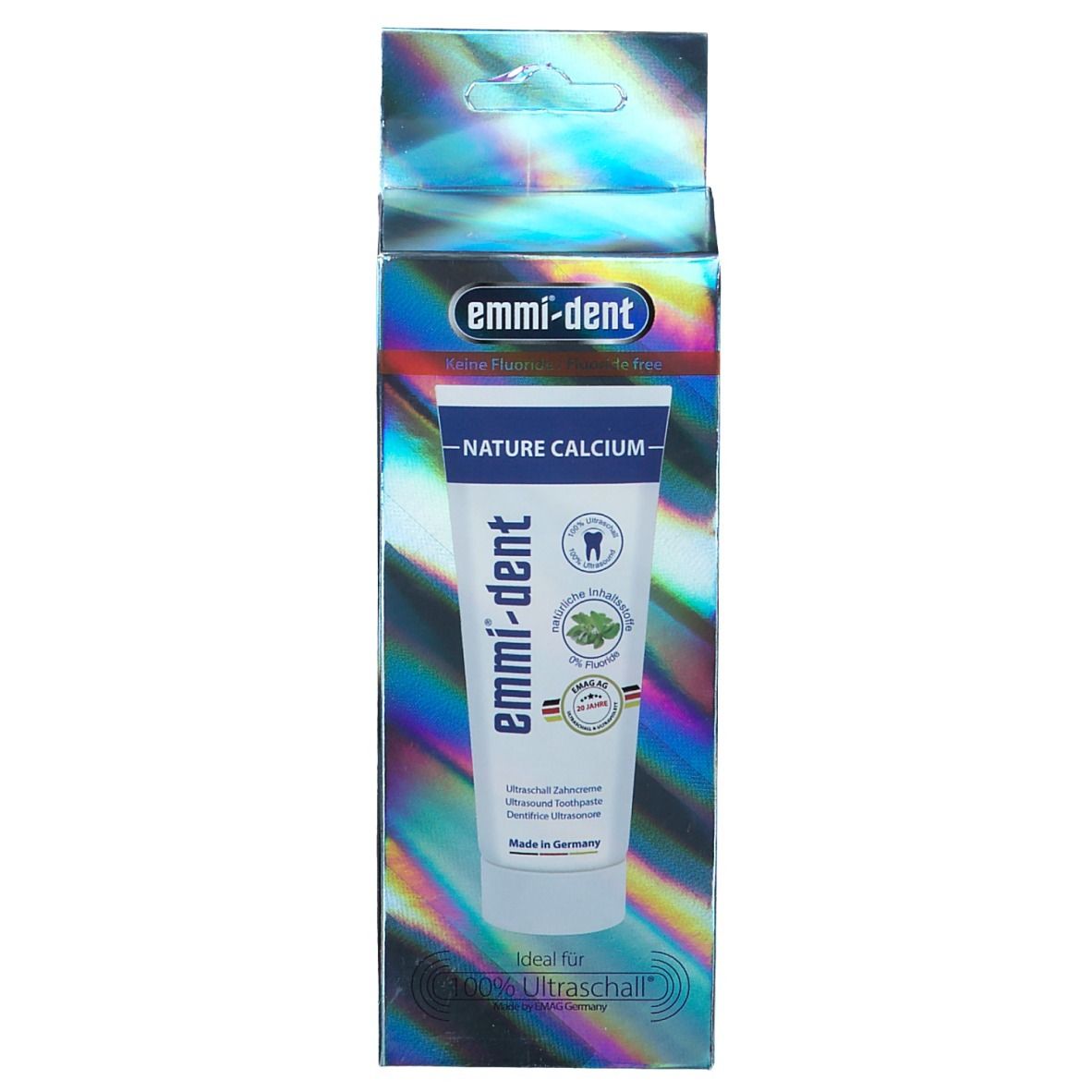 Emballage du dentifrice. Bleu-argenté. Inscriptions: emmi-dent, Nature Calcium, 0% Fluorure. Avec sceaux et 'Made in Germany'.