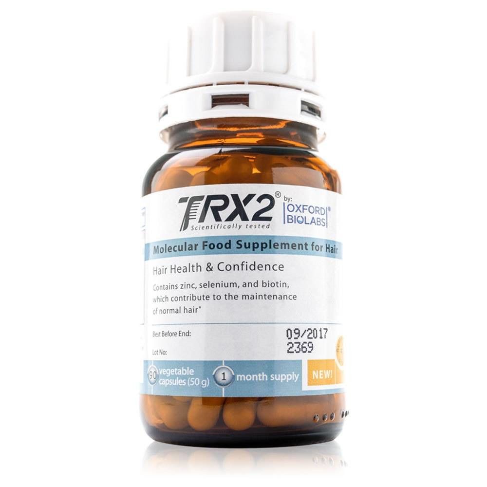 Bruine fles met TRX2 voedingssupplement voor haar. Bevat capsules. Opschrift: Molecular Food Supplement for Hair. Bevat zink, selenium en biotine.