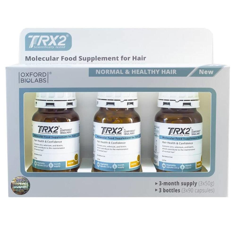Verpackung mit drei Flaschen. Auf jeder Flasche steht TRX2. Auf der Verpackung steht "Molecular Food Supplement for Hair".