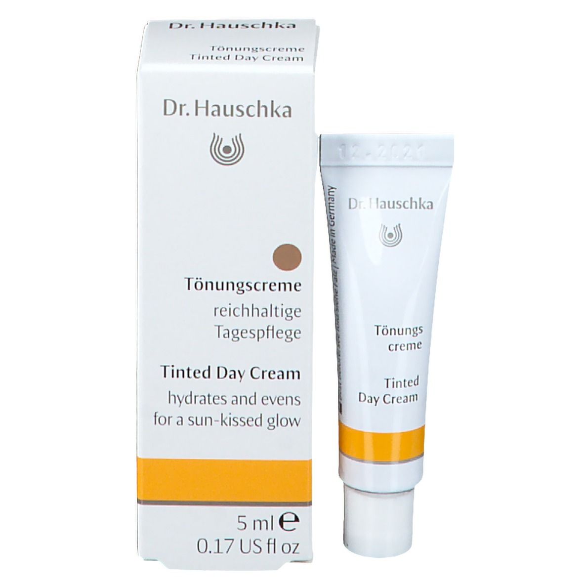 Doos en tube. Opschrift: Dr. Hauschka, Tönungscreme, 5 ml. Tube met gele streep.