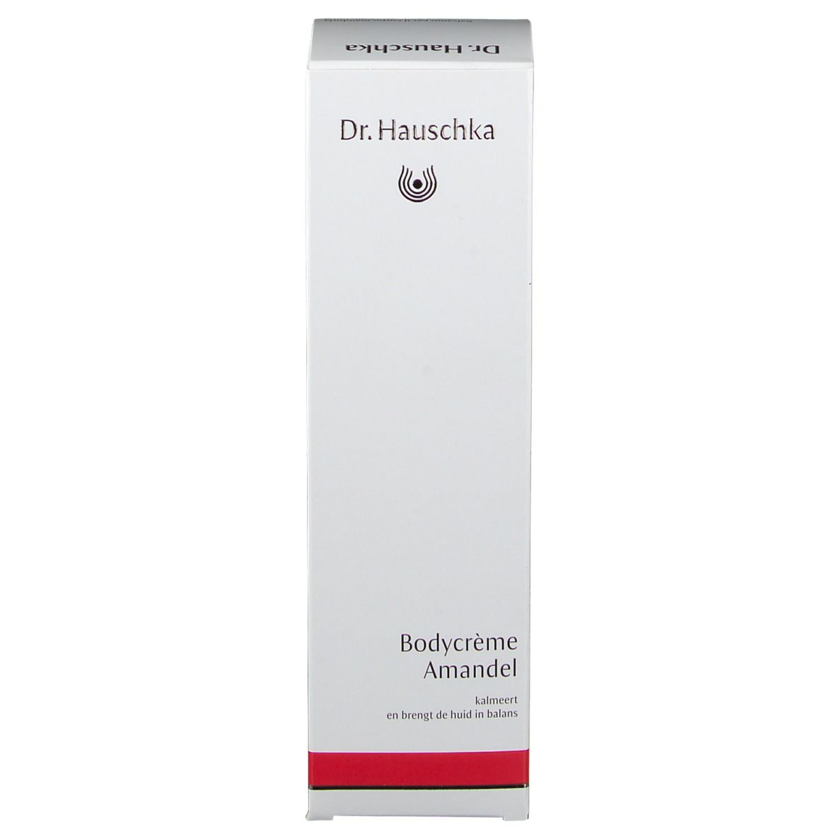 Schachtel, weiß mit rotem Streifen. Aufschrift: Dr. Hauschka, Bodycrème Mandel. Produktname.