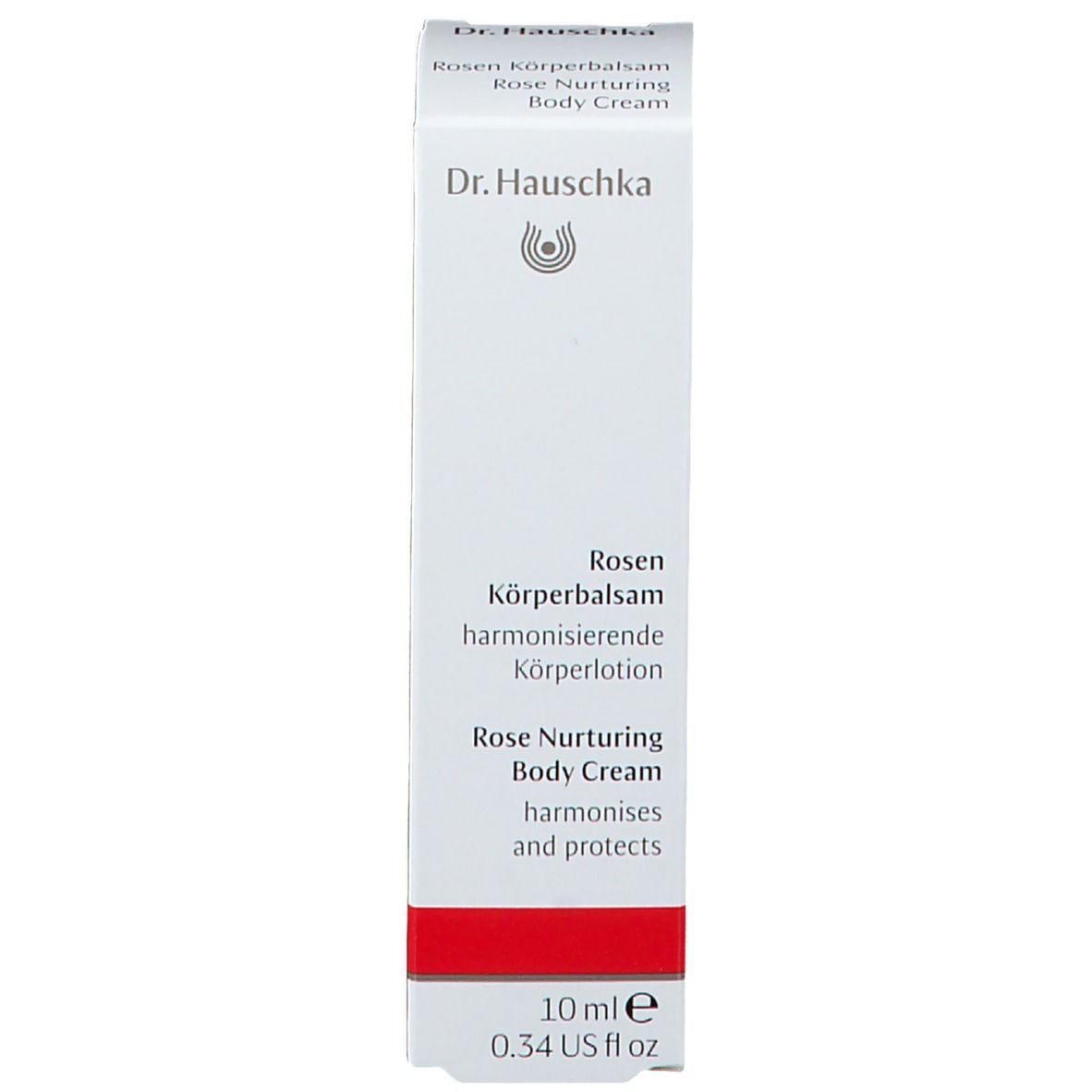Boîte blanche avec bande rouge. Inscription: Dr. Hauschka, Rosen Körperbalsam, 10 ml.