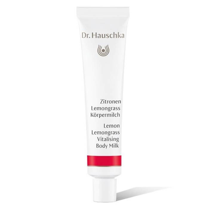 Weiße Tube mit rotem Streifen. Beschriftung: Dr. Hauschka, Zitrone Lemongrass, Körpermilch, Lemon Lemongrass Vitalising Body Milk.