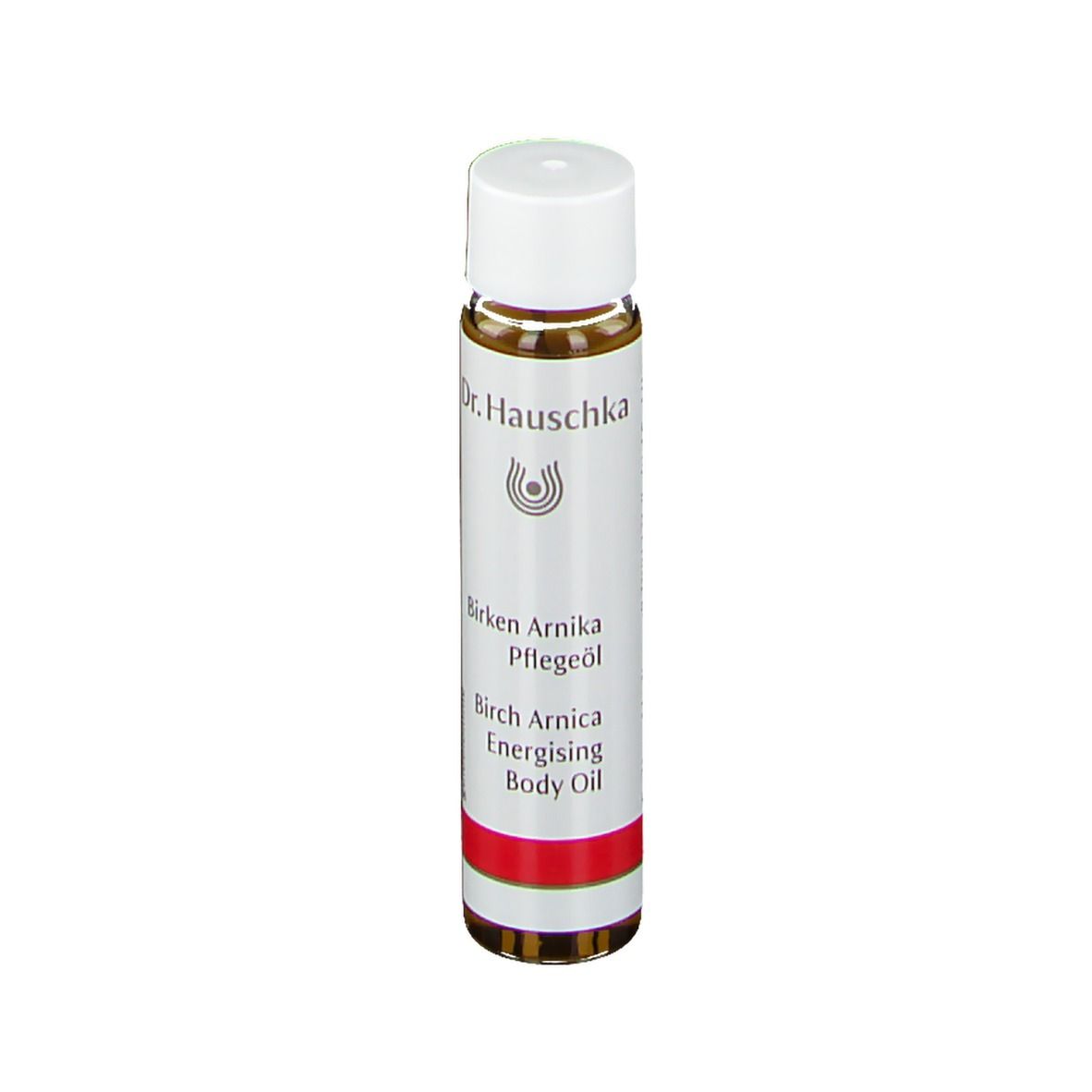 Transparante fles met witte dop en rode streep. Opschrift: Dr. Hauschka, Birken Arnika Pflegeöl, Birch Arnica Energising Body Oil.