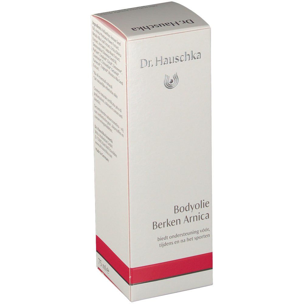 Weißer Karton mit rotem Streifen. Aufschrift: Bodyolie Berken Arnica. Logo Dr. Hauschka.