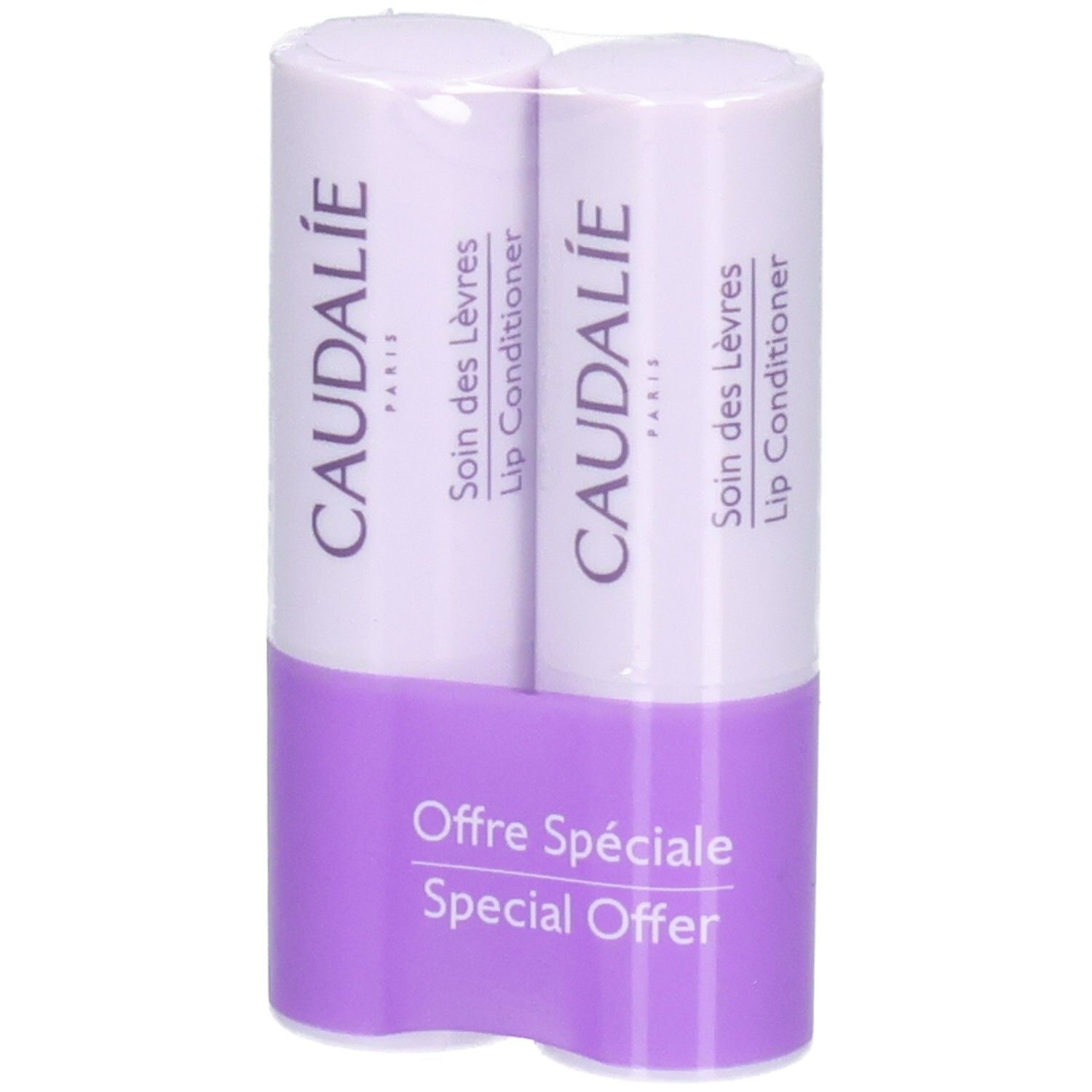 Zwei Lippenpflegestifte in Verpackung. Marke CAUDALIE. Lila Halterung mit Text: Offre Spéciale, Special Offer.