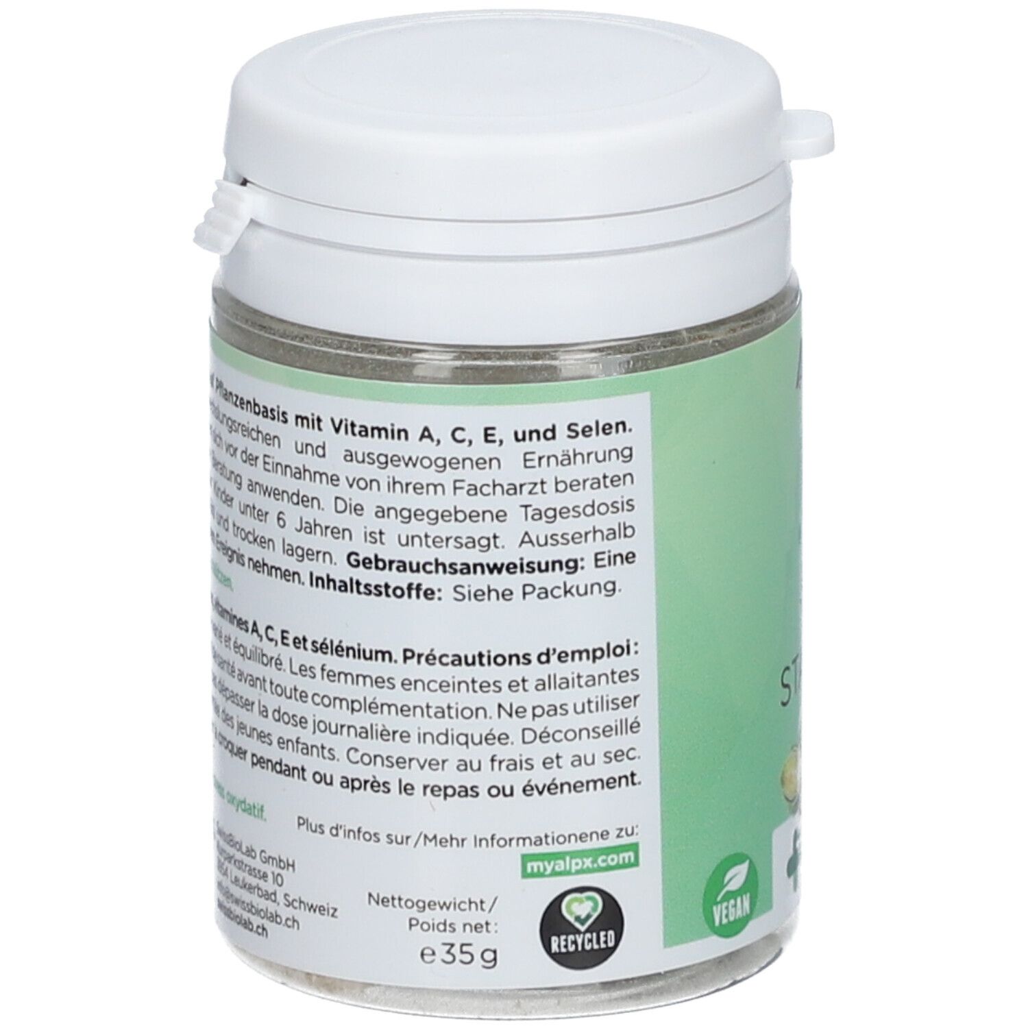 Dos de la boîte verte avec couvercle blanc. Texte en allemand et français. Logo vegan. Poids : 35g.