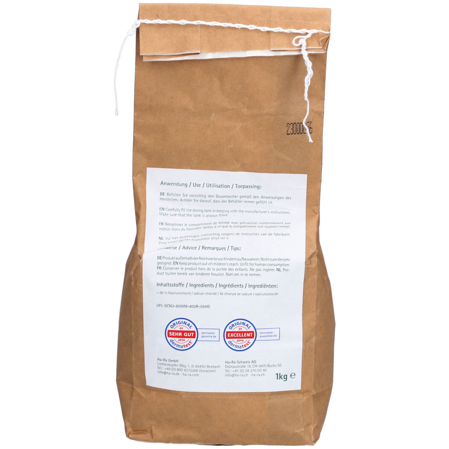 Rückseite der braunen Papiertüte. Text in mehreren Sprachen. Siegel: Sehr Gut, Excellent. Gewicht: 1kg.