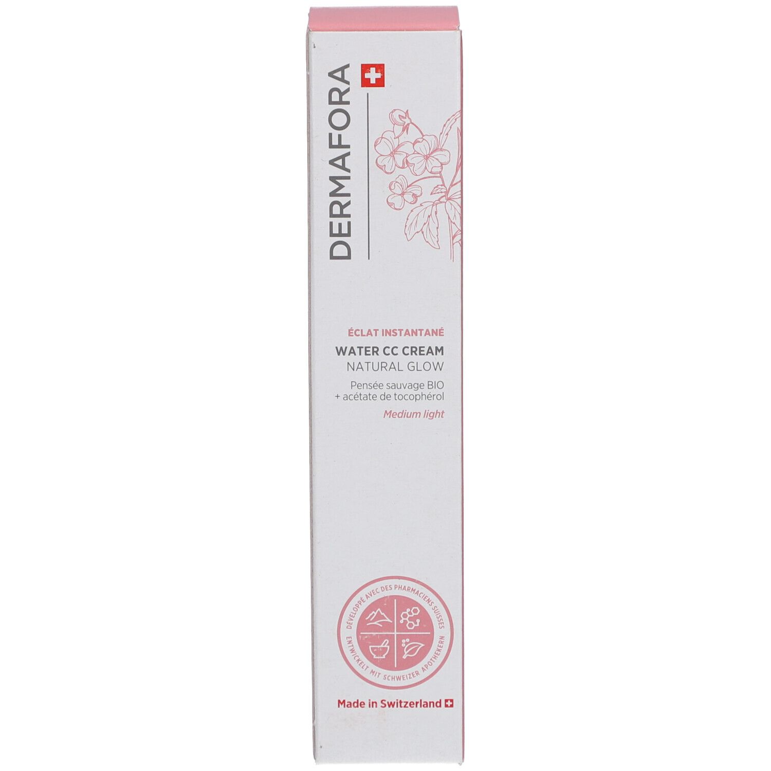 Schachtel mit rosa Akzenten. Aufschrift: Dermafora, Water CC Cream Natural Glow. Schweizer Kreuz und florales Muster.