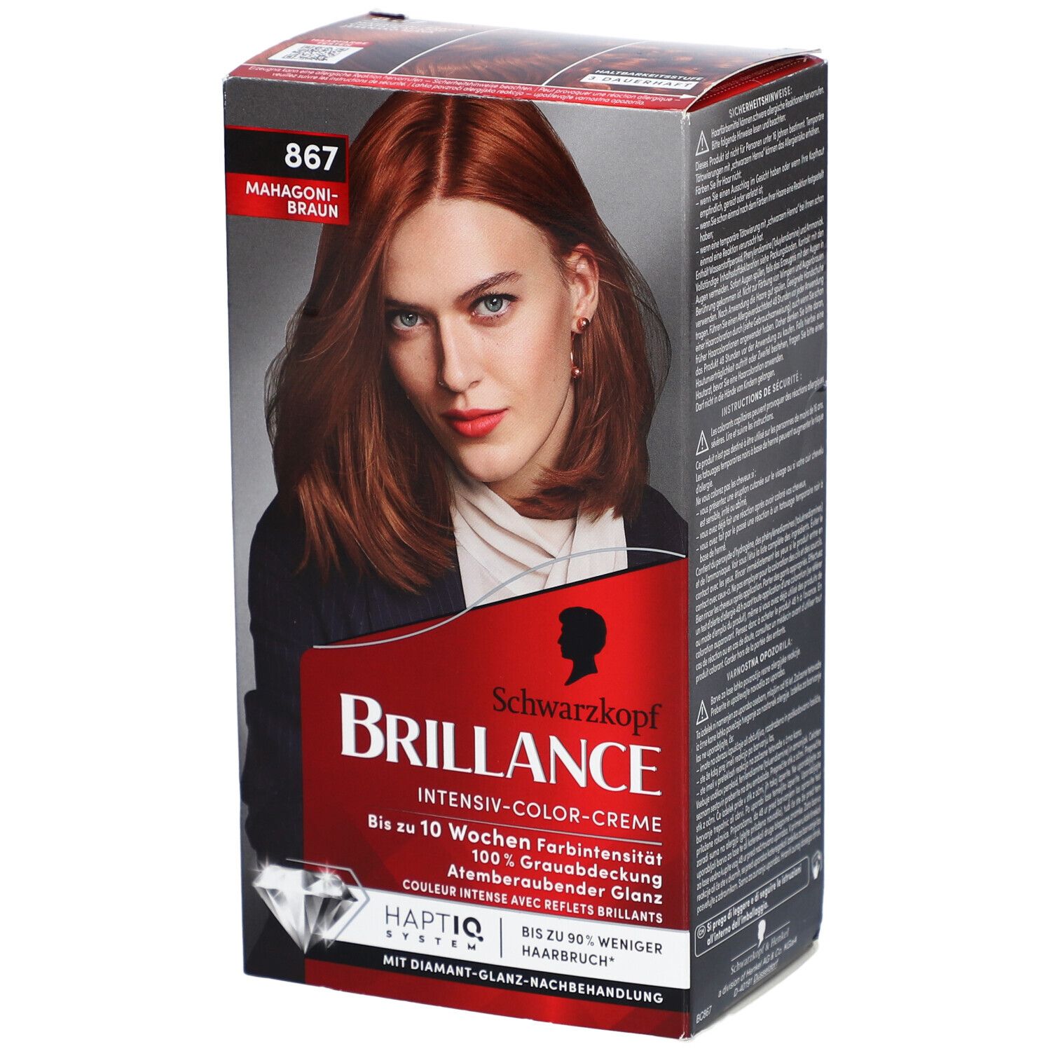 Haarfarbe-Packung. Schwarzkopf Brillance, Farbton 867 Mahagonibraun. Frau mit rotbraunem Haar auf der Verpackung.