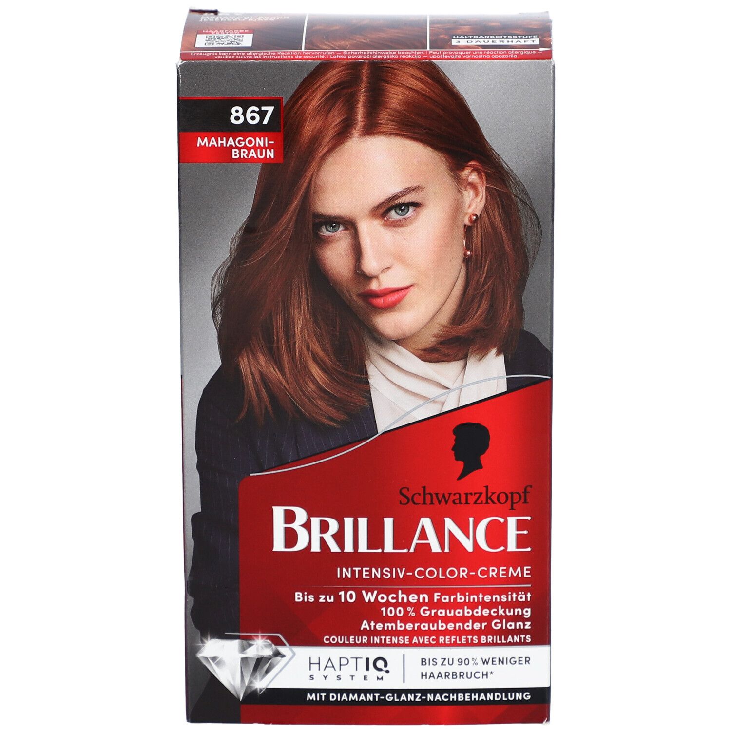 Haarfarben-Packung. Schwarzkopf Brillance, Farbton 867 Mahagonibraun. Frau mit rotbraunem Haar auf der Verpackung.