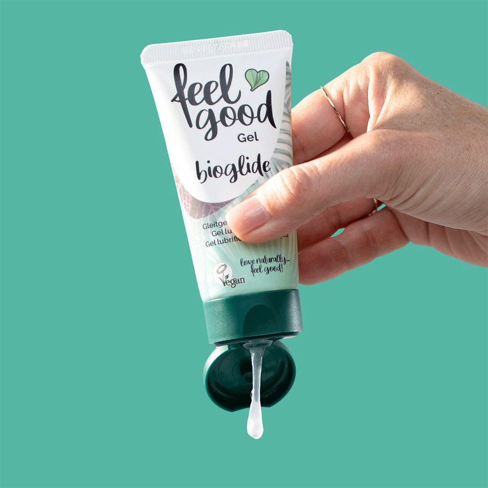 Tube blanc avec bouchon vert, nom et logo du produit. Gel coulant de l'ouverture. Design vert et blanc.