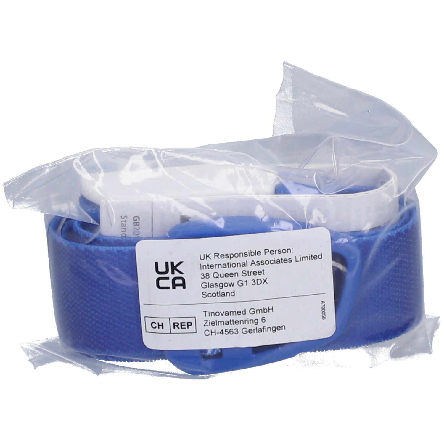 Garrot bleu en sachet plastique. Étiquette: UKCA, CH REP, adresse.