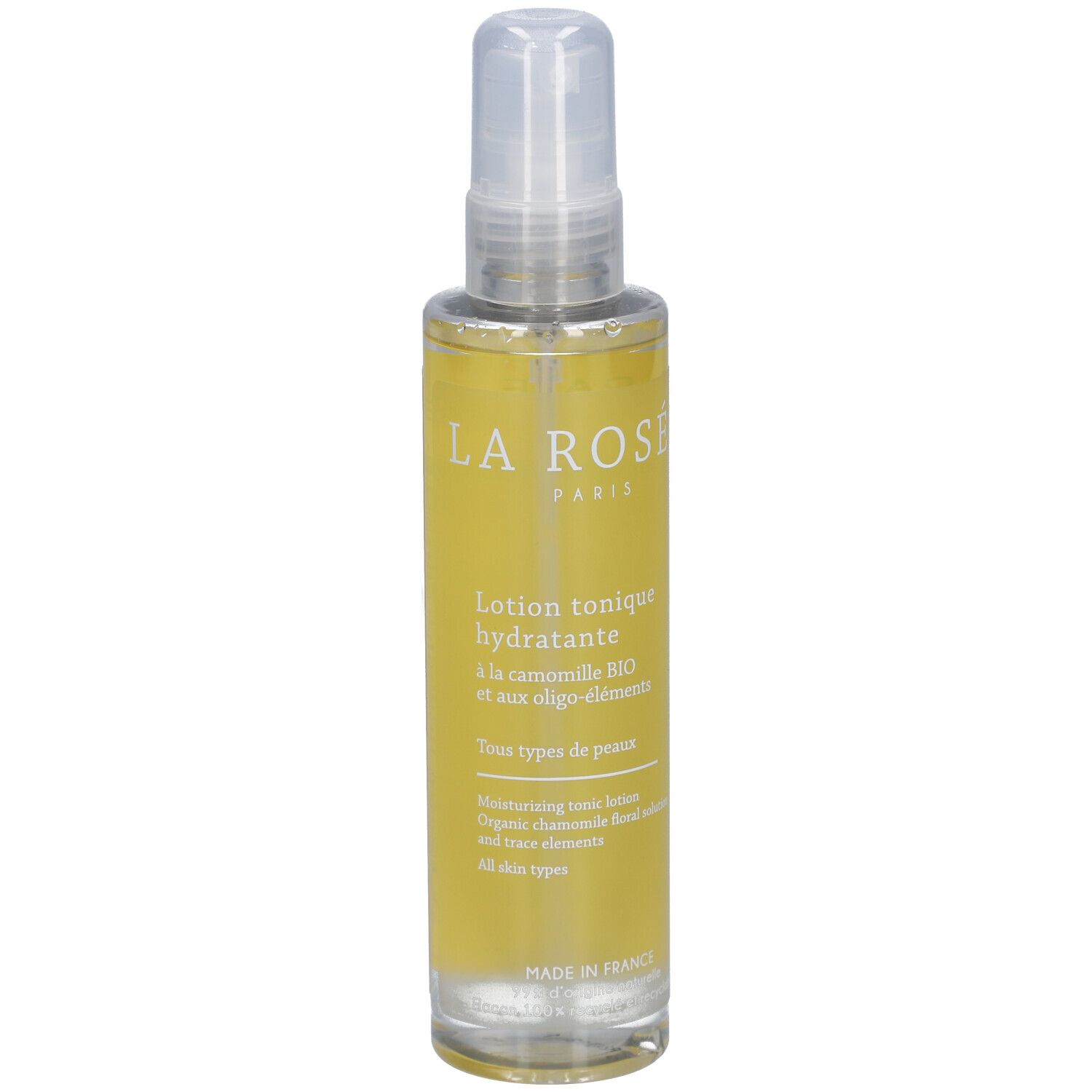 Flacon de lotion tonique avec vaporisateur. Liquide jaune, impression blanche: LA ROSÉE PARIS. Texte: Lotion tonique hydratante.