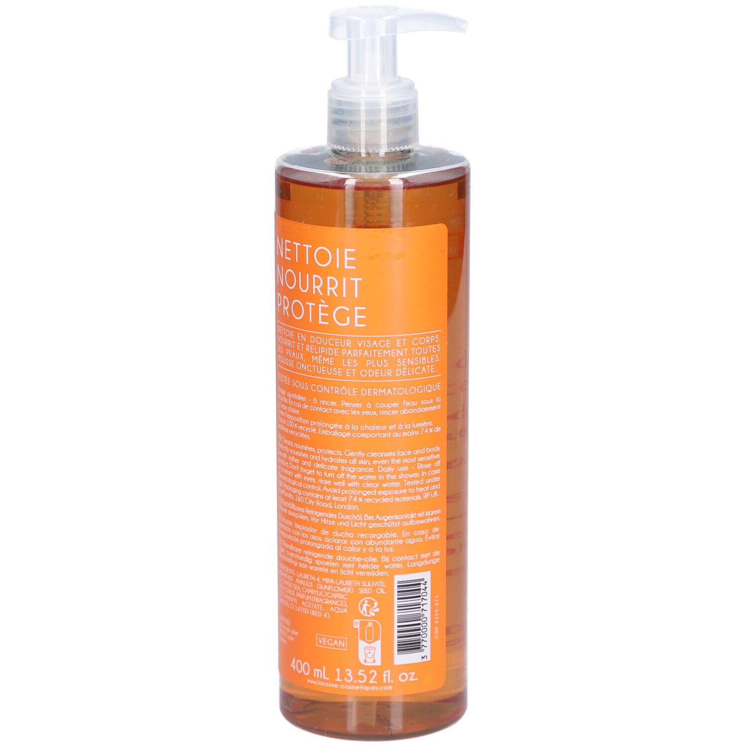 Dos d'un flacon transparent avec liquide orangé. Texte: Nettoie, Nourrit, Protège. 400 ml.