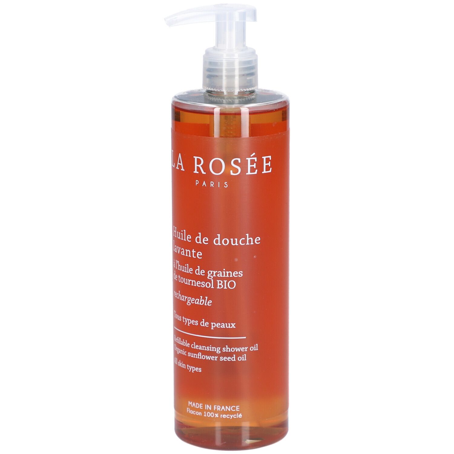 Flacon transparent avec liquide orangé et pompe doseuse. Inscription: La Rosée, Huile de douche lavante.