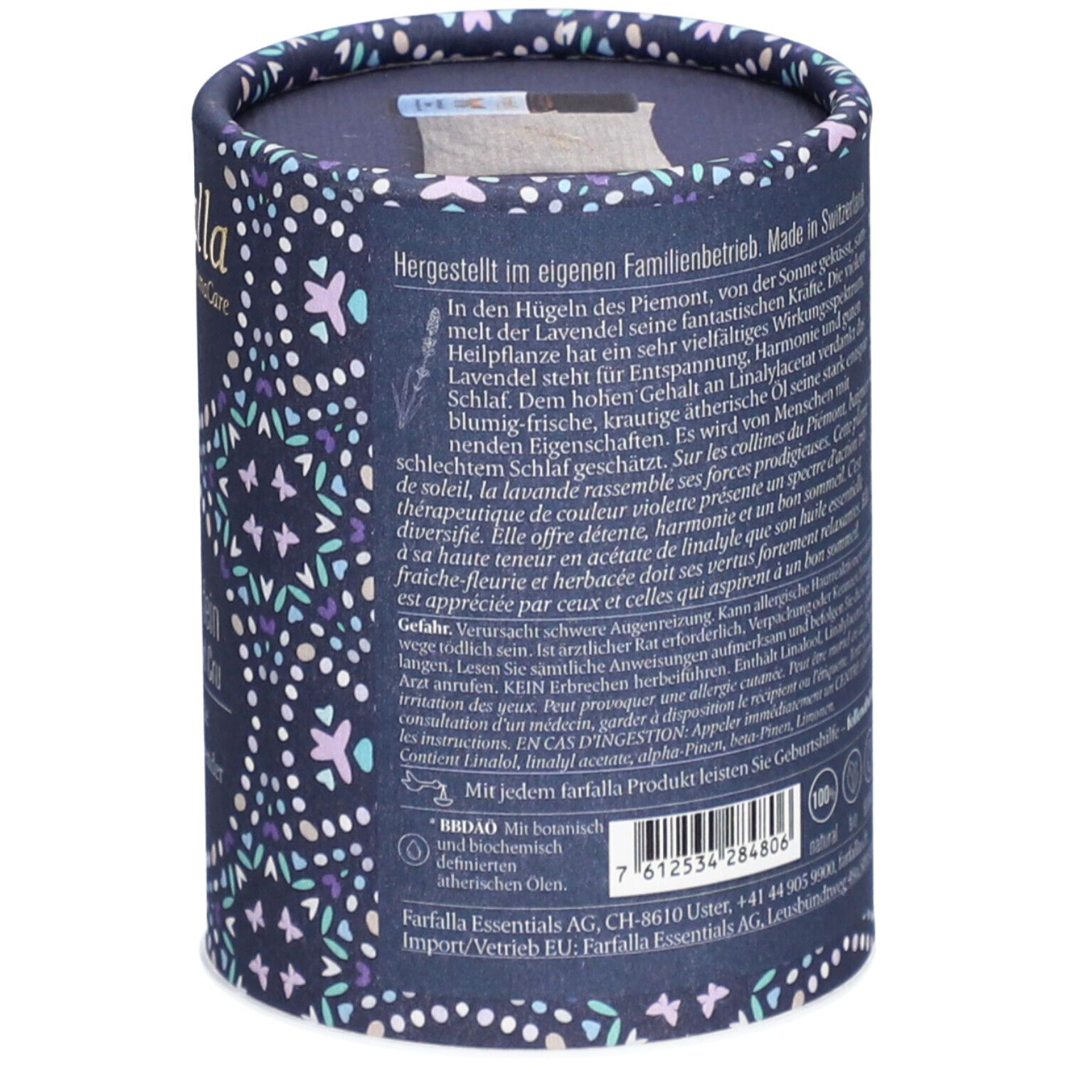 Emballage cylindrique à motifs floraux. Texte : informations fabricant, ingrédients, instructions, certifications.