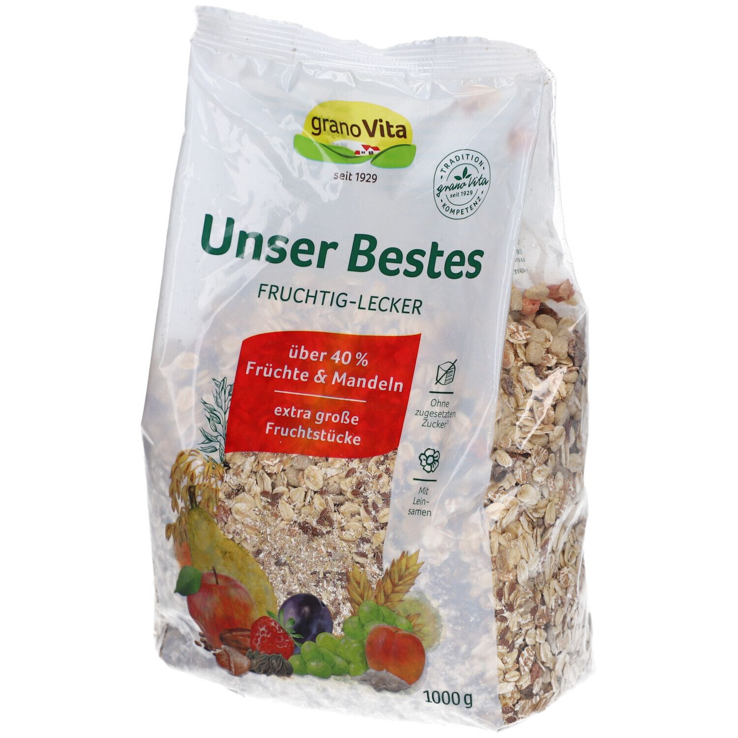 Klare Plastikverpackung mit Müsli. Aufschrift: granoVita, Unser Bestes, über 40% Früchte & Mandeln. Abbildung von Früchten.