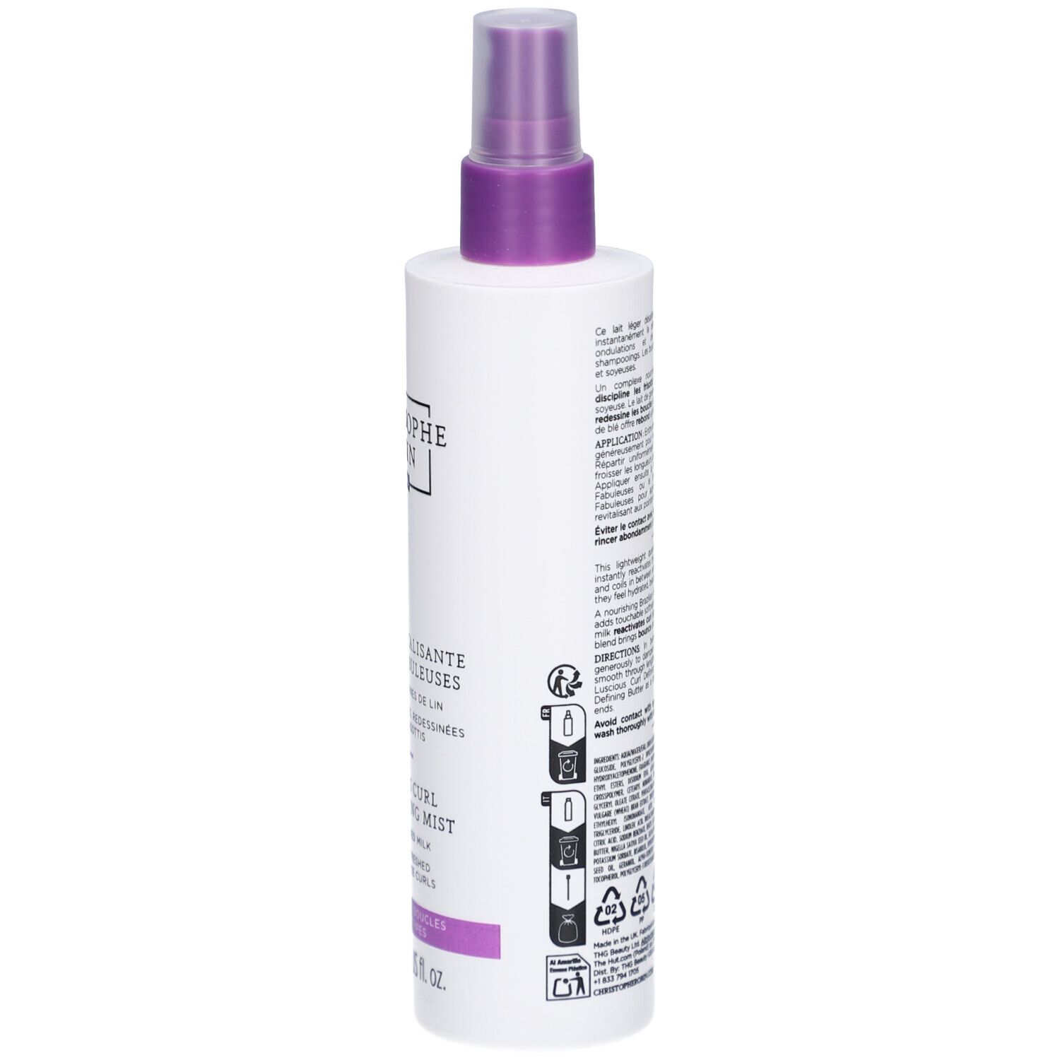 Weiße Flasche mit lila Sprühkopf. Text auf der Rückseite. Produktname: Brume Revitalisante Boucles Fabuleuses. Recycling-Symbole.