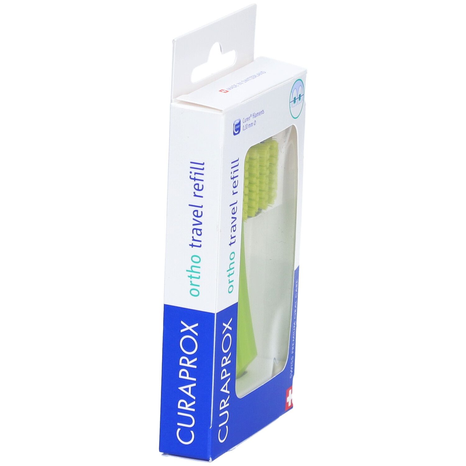 Emballage avec une tête de brosse à dents verte. "CURAPROX" et "ortho travel refill" sont visibles.
