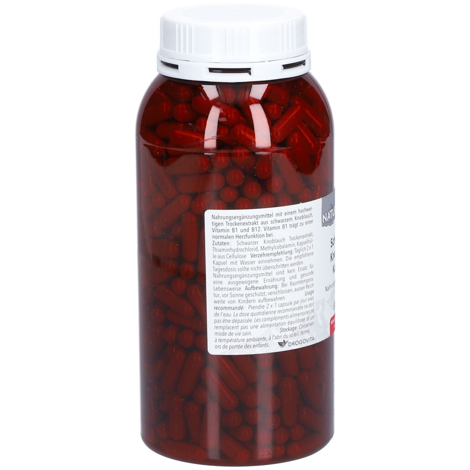Rückansicht der Flasche mit schwarzen Knoblauch Kapseln. Etikett mit Produktinformationen. Schwarze Kapseln im transparenten Behälter.