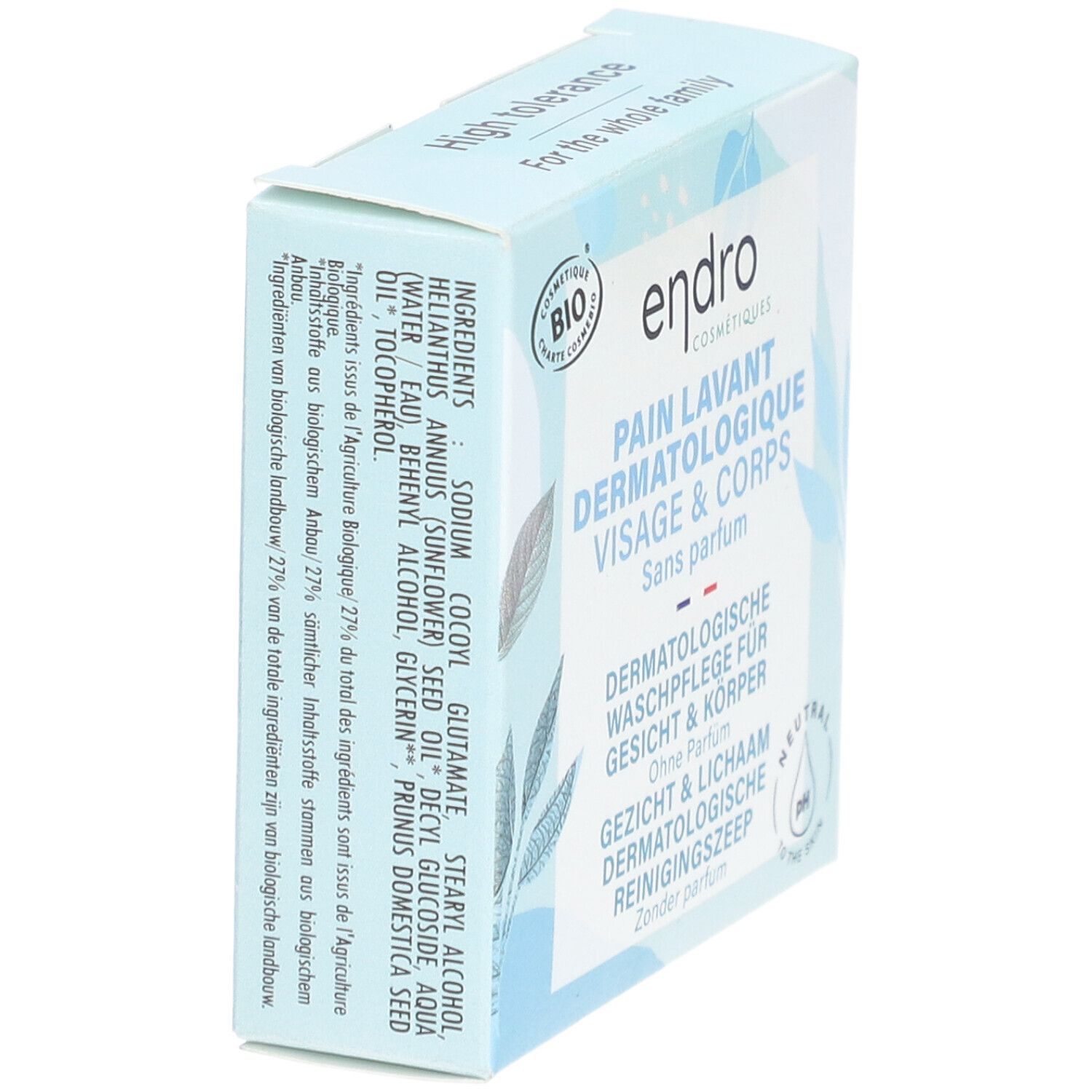 Boîte bleu clair avec nom et logo du produit. Texte: PAIN LAVANT DERMATOLOGIQUE VISAGE & CORPS. Liste des ingrédients sur le côté.