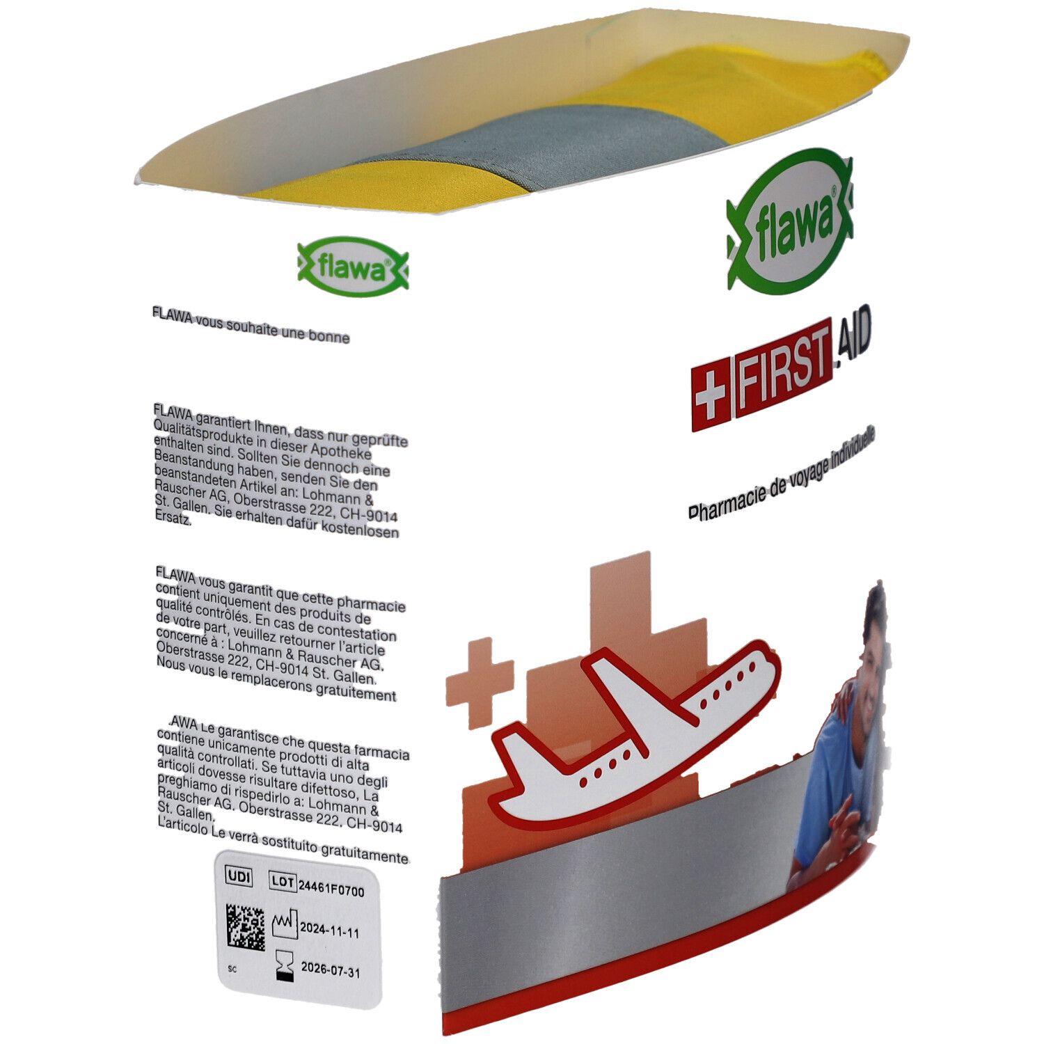 Verpackung der FLAWA Reise-Apotheke. Logo, Schriftzug "FIRST AID" und Flugzeug-Symbol. Text in Deutsch, Französisch und Italienisch.
