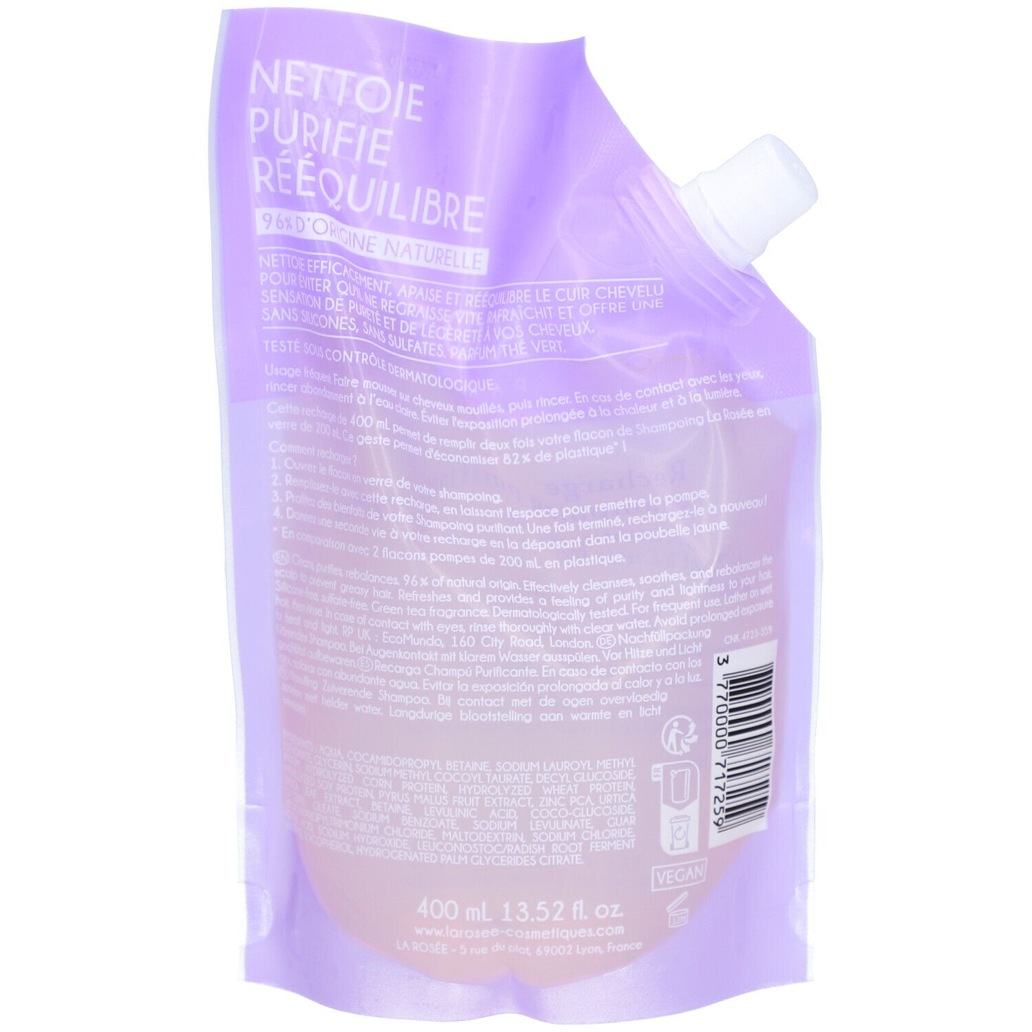 Dos de la recharge de shampooing. Sachet violet clair avec bouchon blanc. Texte: Nettoie, purifie, rééquilibre. 400 ml.