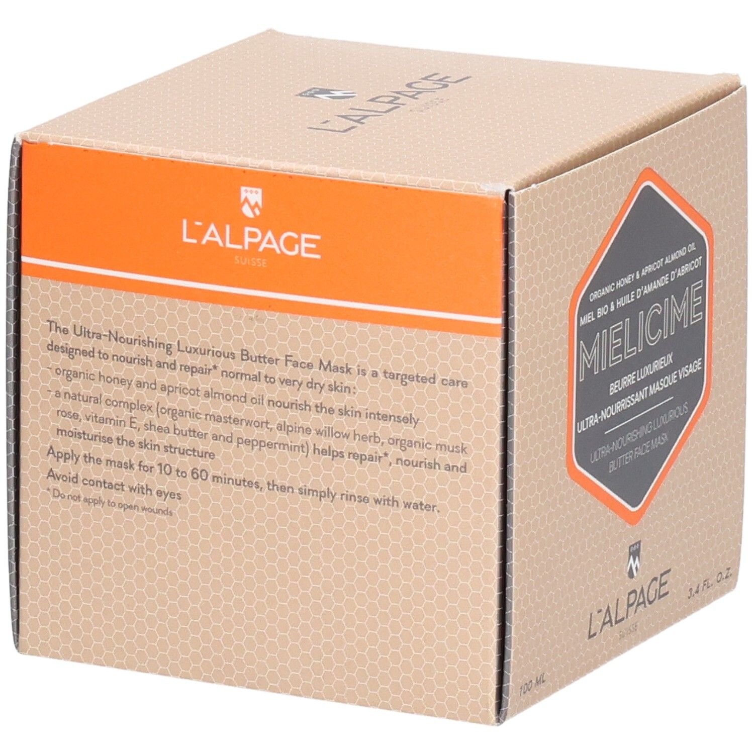 Kartonverpackung mit Produktbeschreibung. Orangefarbener Akzent. Text: Ultra-pflegende Gesichtsmaske. Marke: L'ALPAGE.
