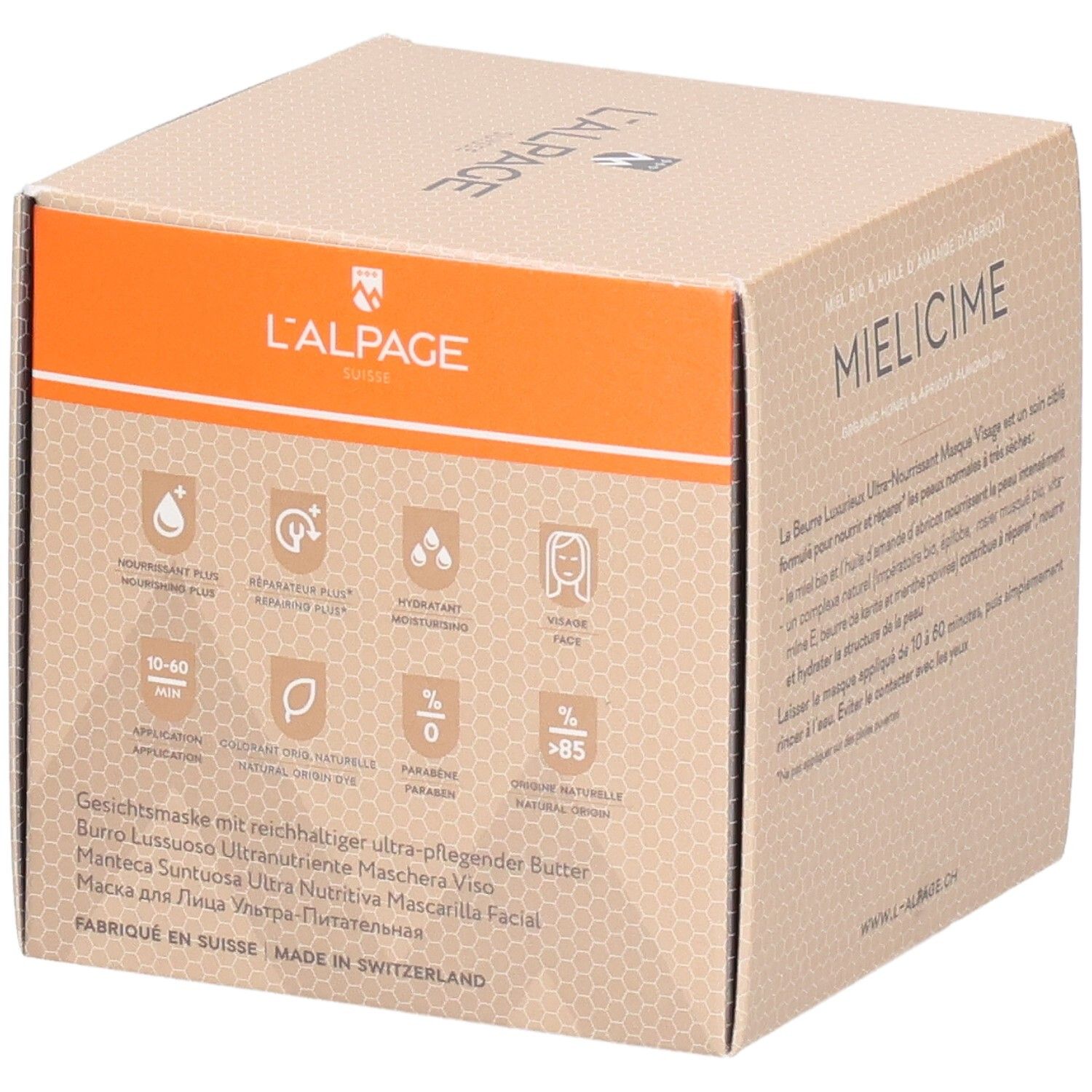 Kartonverpackung mit Produktbeschreibung und Icons. Orangefarbener Akzent. Text: Gesichtsmaske. Marke: L'ALPAGE.