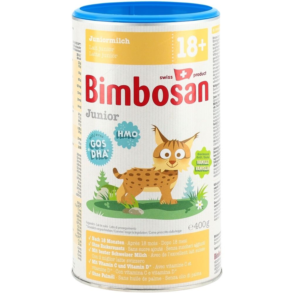Boîte de lait en poudre avec couvercle bleu. Inscription "Bimbosan Junior" et "18+". Illustration d'un lynx.